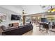 Living room with wood flooring, large sectional, and backyard views at 2585 E Morgan Dr, Gilbert, AZ 85295