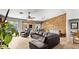 Open living room featuring leather furniture, wood floors, and view to patio at 2585 E Morgan Dr, Gilbert, AZ 85295
