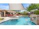 Gorgeous pool area with water features, outdoor seating, and a covered patio perfect for relaxation at 2585 E Morgan Dr, Gilbert, AZ 85295