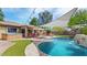 Inviting outdoor space with a pool, lounge seating, and a well-manicured lawn for entertaining at 2585 E Morgan Dr, Gilbert, AZ 85295
