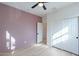 Bedroom with ample closet space and light wood floors at 25925 N 53Rd Dr, Phoenix, AZ 85083