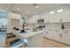 Bright kitchen featuring white cabinets, a quartz countertop island, and modern stainless-steel appliances at 25925 N 53Rd Dr, Phoenix, AZ 85083