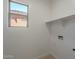 Bright laundry room with a window and hookups at 25925 N 53Rd Dr, Phoenix, AZ 85083