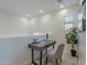 Well-lit home office featuring a modern desk, chair, and natural light streaming through a nearby window at 25925 N 53Rd Dr, Phoenix, AZ 85083