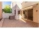 A cozy backyard patio featuring brick flooring provides a private outdoor space for relaxation and entertainment at 28967 N 124Th Ave, Peoria, AZ 85383