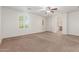 Bedroom with carpet, three windows, and ceiling fan at 28967 N 124Th Ave, Peoria, AZ 85383