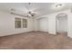 Spacious bedroom with carpet, ceiling fan, and natural light at 28967 N 124Th Ave, Peoria, AZ 85383