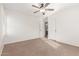 Bedroom featuring neutral walls, carpet, ceiling fan, and two closets at 28967 N 124Th Ave, Peoria, AZ 85383