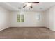 Bedroom featuring neutral walls, carpet, and windows with shutters at 28967 N 124Th Ave, Peoria, AZ 85383
