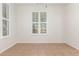 Neutral living room with plantation shutters and white walls at 28967 N 124Th Ave, Peoria, AZ 85383