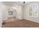 Inviting living room features neutral carpeting, white walls and arched doorways at 28967 N 124Th Ave, Peoria, AZ 85383