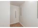 A well-organized walk-in closet features neutral tile flooring with shelving for easy storage at 28967 N 124Th Ave, Peoria, AZ 85383