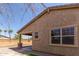 Charming single story home shows the covered patio, low maintenance landscaping, and great curb appeal at 296 N Jesse St, Chandler, AZ 85225