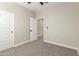 Bedroom featuring carpet flooring, neutral walls, and an adjoining open door at 296 N Jesse St, Chandler, AZ 85225