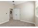 Bedroom featuring neutral walls, carpet flooring and multiple entryways at 296 N Jesse St, Chandler, AZ 85225