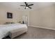 Spacious bedroom featuring neutral walls, plush carpet, comfortable decor and a view of the ensuite bathroom at 296 N Jesse St, Chandler, AZ 85225