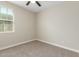 Bedroom featuring neutral walls, carpet flooring and a bright window at 296 N Jesse St, Chandler, AZ 85225
