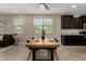Dining area featuring a wooden table with seating, neutral walls, and plenty of natural light at 296 N Jesse St, Chandler, AZ 85225