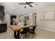 Dining area featuring a wooden table with seating, adjacent to the kitchen at 296 N Jesse St, Chandler, AZ 85225