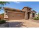 Attractive single-story home featuring a stone accent, two-car garage, and low-maintenance desert landscaping at 296 N Jesse St, Chandler, AZ 85225