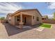 Charming single story home shows the covered patio, low maintenance landscaping, and great curb appeal at 296 N Jesse St, Chandler, AZ 85225