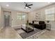 Bright living room with neutral walls, tiled floors, and a comfortable sofa at 296 N Jesse St, Chandler, AZ 85225