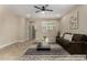 Cozy living room with neutral walls, plush rug, and a comfortable sofa at 296 N Jesse St, Chandler, AZ 85225