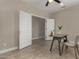 Versatile office featuring neutral walls, stylish desk, tiled floors, double doors and bright natural light at 296 N Jesse St, Chandler, AZ 85225