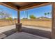 The covered patio offers a great space to relax outdoors, complete with stone pillars and a gravel ground cover at 296 N Jesse St, Chandler, AZ 85225