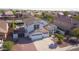 Aerial view showcasing home, three car garage, manicured yard, and private pool at 2977 E County Down Dr, Chandler, AZ 85249