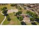 Aerial view of neighborhood park featuring playgrounds, sports courts, sidewalks, and green spaces for community recreation at 2977 E County Down Dr, Chandler, AZ 85249