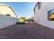 Spacious backyard area surrounded by block wall, providing privacy for outdoor activities and relaxation at 2977 E County Down Dr, Chandler, AZ 85249