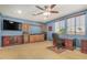 Bedroom featuring an executive desk, built-in storage, and a ceiling fan at 2977 E County Down Dr, Chandler, AZ 85249