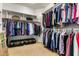 Walk-in closet with built-in shelving, hanging rods, and ample space for organization at 2977 E County Down Dr, Chandler, AZ 85249