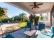 Inviting covered patio with comfortable seating, perfect for enjoying outdoor dining and relaxation by the pool at 2977 E County Down Dr, Chandler, AZ 85249
