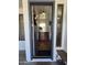 Open entryway leading into a bright living space with wood floors and a staircase at 2977 E County Down Dr, Chandler, AZ 85249