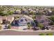 Beautiful home in Sun River boasts a two-car garage, tile roof, and well-manicured landscaping at 2977 E County Down Dr, Chandler, AZ 85249