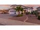 Charming two-story home with a three-car garage and desert landscaping at 2977 E County Down Dr, Chandler, AZ 85249