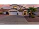 Charming two-story home with a three-car garage and manicured landscaping at 2977 E County Down Dr, Chandler, AZ 85249