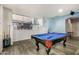 An inviting game room featuring a pool table, and access to more living space at 2977 E County Down Dr, Chandler, AZ 85249