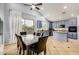 A spacious kitchen with blue cabinets, granite countertops, and an island, next to a dining area at 2977 E County Down Dr, Chandler, AZ 85249
