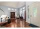 Bright living room featuring hardwood floors, high ceilings, and ample natural light at 2977 E County Down Dr, Chandler, AZ 85249