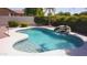 Inviting private pool area with a rock waterfall feature perfect for hot days and backyard fun at 2977 E County Down Dr, Chandler, AZ 85249