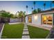 Expansive backyard with lush green grass, a paver patio, and privacy fence perfect for outdoor enjoyment at 3517 E Monterosa St, Phoenix, AZ 85018