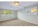 Bright bedroom with carpet floors, fresh neutral paint, recessed lighting, and views of the street at 3517 E Monterosa St, Phoenix, AZ 85018