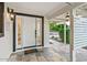 Inviting front porch with decorative tile flooring, stylish lighting, and a welcoming entrance at 3517 E Monterosa St, Phoenix, AZ 85018