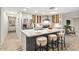 Modern kitchen with a large island, stainless steel appliances, white countertops, and stylish cabinetry at 3517 E Monterosa St, Phoenix, AZ 85018