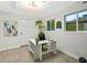 Bright home office with tile floors, modern desk, natural light, and fresh neutral paint at 3517 E Monterosa St, Phoenix, AZ 85018