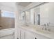A bathroom offers dual vanity sinks, a shower and bath combo, and updated fixtures at 3605 W Bethany Home Rd # 7, Phoenix, AZ 85019