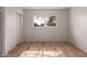 Charming bedroom with a bright window and wood-look tile flooring at 3605 W Bethany Home Rd # 7, Phoenix, AZ 85019